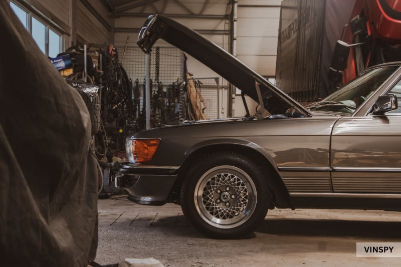 Classic car under repair illustrating how much an accident devalues a car’s worth.