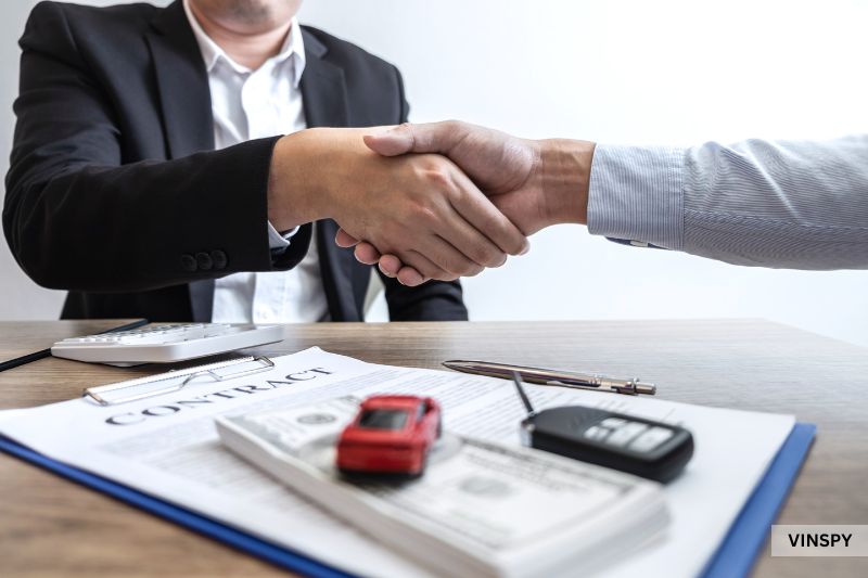 Car sale negotiation showing how much an accident devalues a car before finalising deal